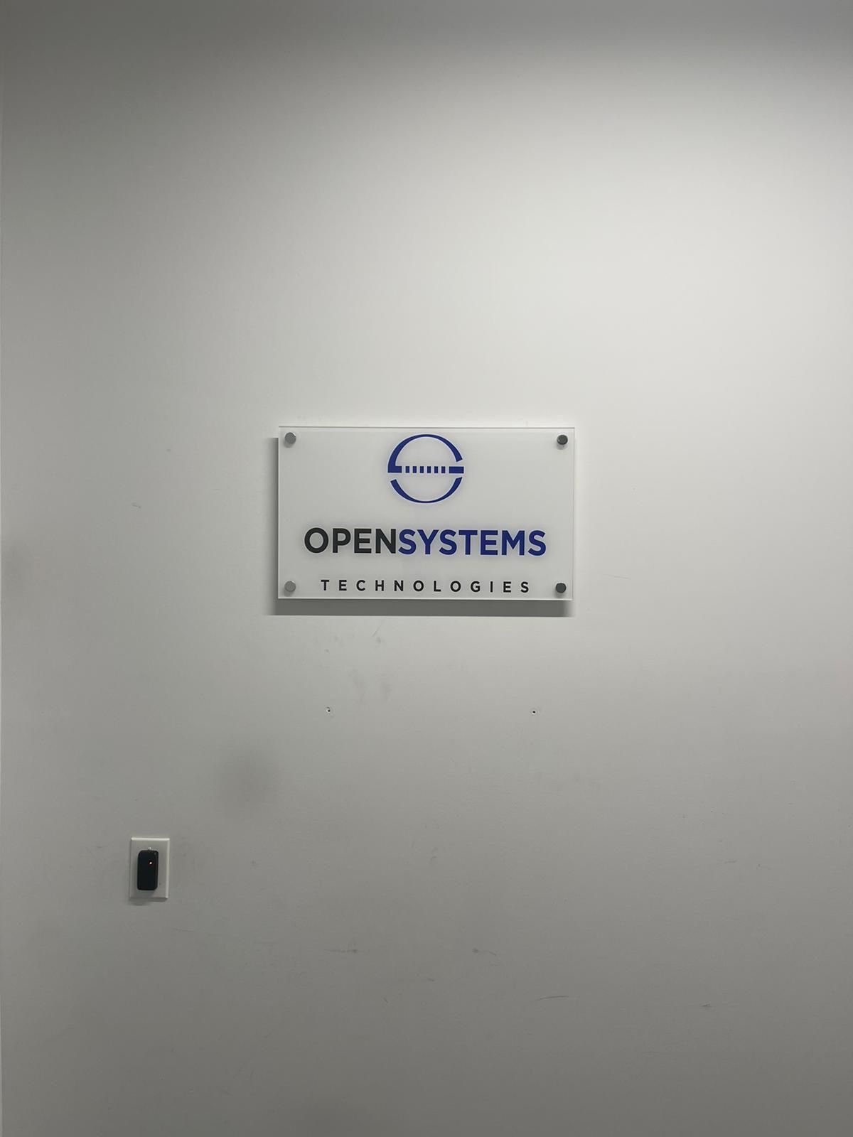 A white wall with a sign on it
