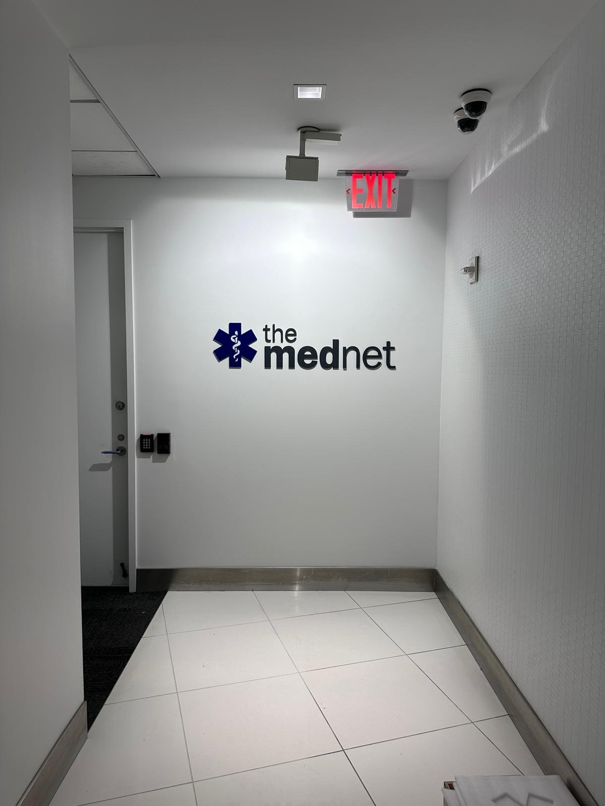 A hallway with the mednet logo on it.