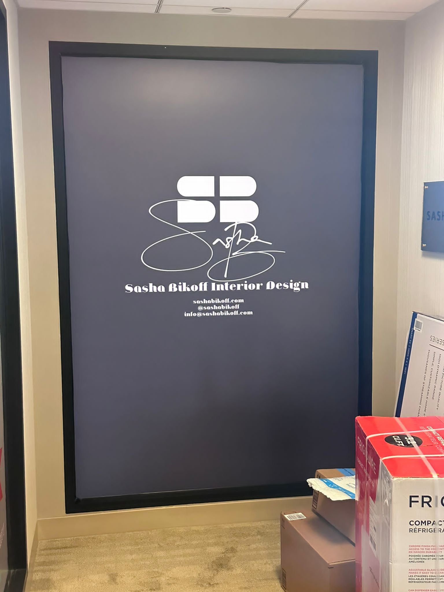 A large poster of the name sandra bibolt interior design.