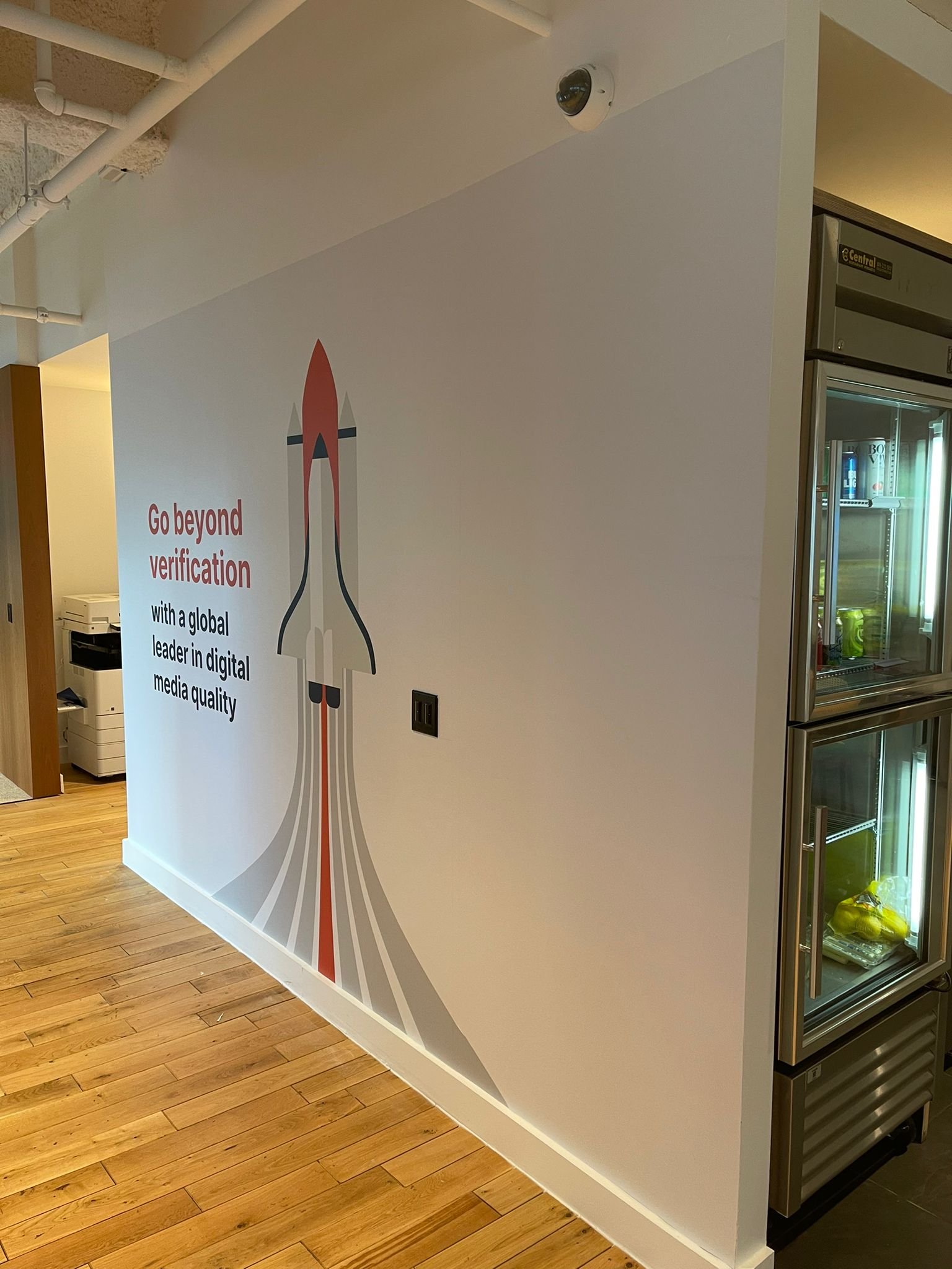 A wall with a picture of a rocket on it.