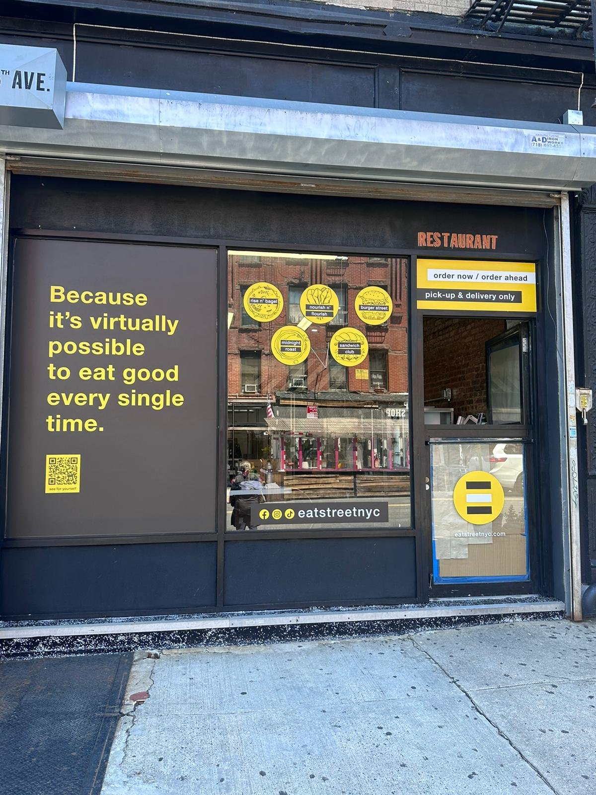 A store front with several signs on the side of it.