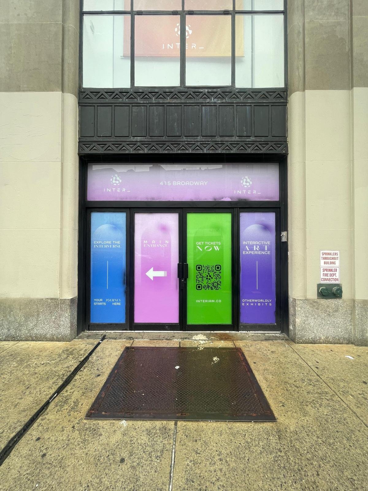 A building with four windows and a door.