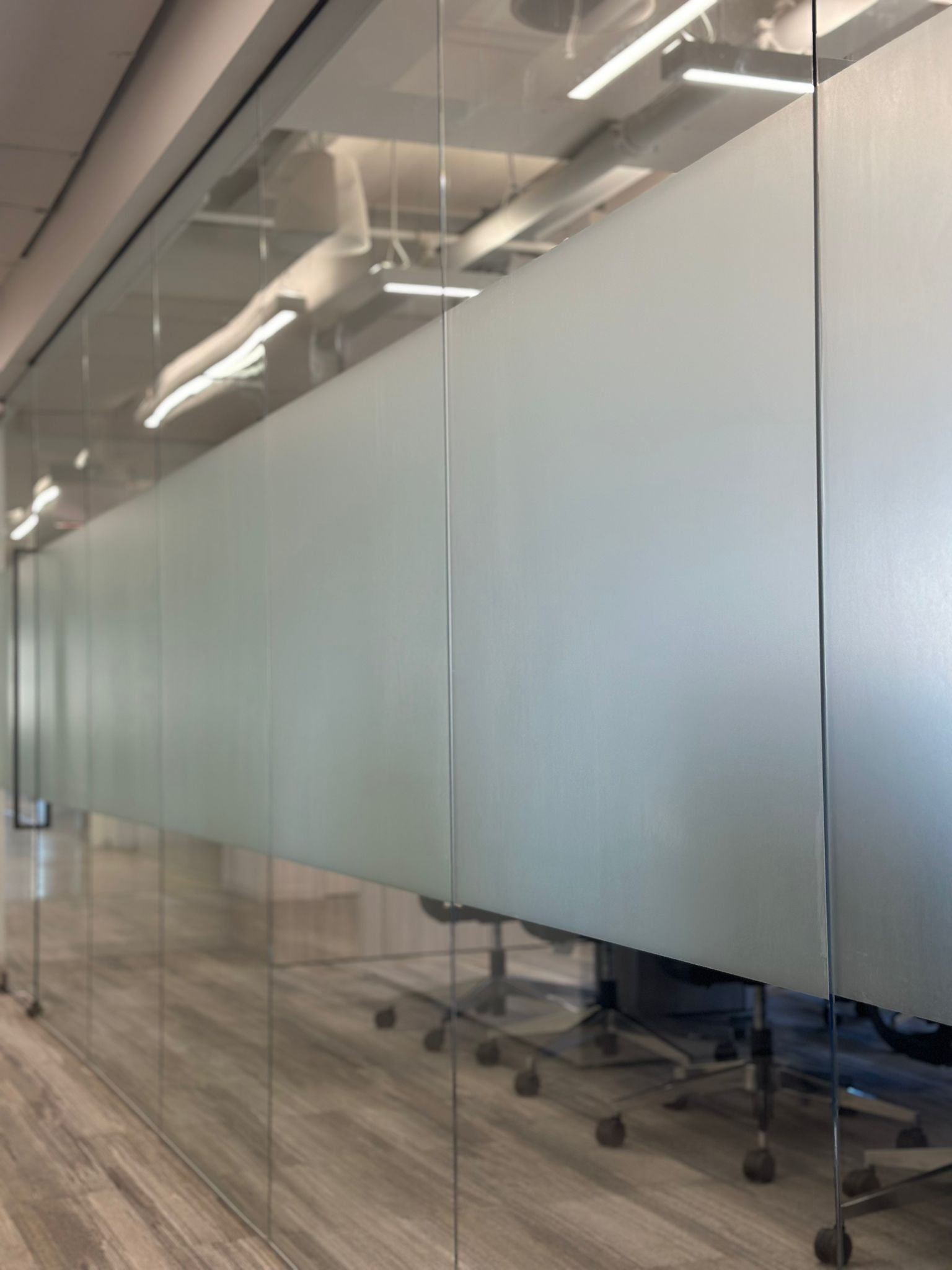 A room with many mirrors on the wall