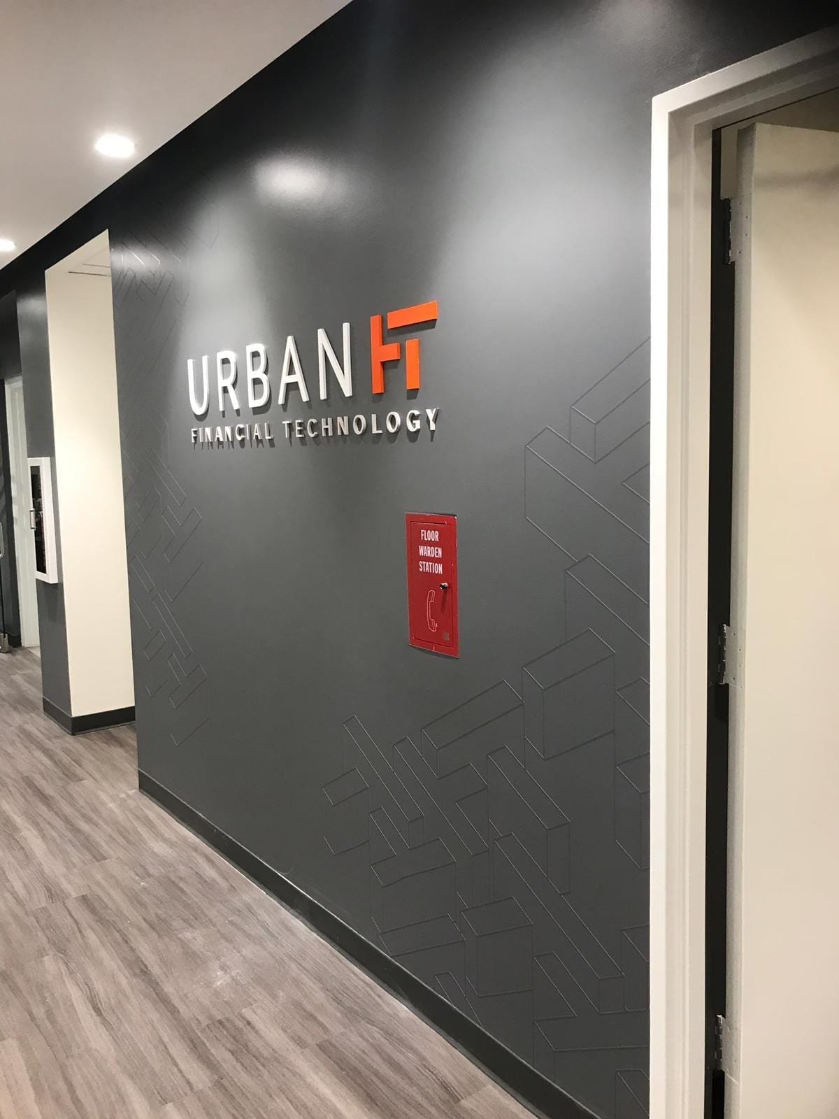 5f60c69b-6860-4659-906f-558dc1ab3d80 - MMK Custom Inc. Urban FT Financial Technology logo wall sign.